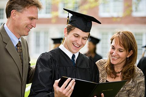 Graduation: Proud Family Admires Diploma