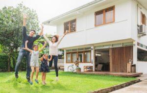 Family in Front of their Home with Homeowner's Insurance in Calhoun, GA, Ballground, Blue Ridge, GA, and Nearby Cities