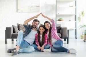 Family Sitting in Their Living Room with Home Insurance in Blue Ridge, GA